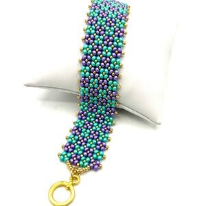 Hand Crafted Purple and Teal Beaded Bracelet with Gold Accents